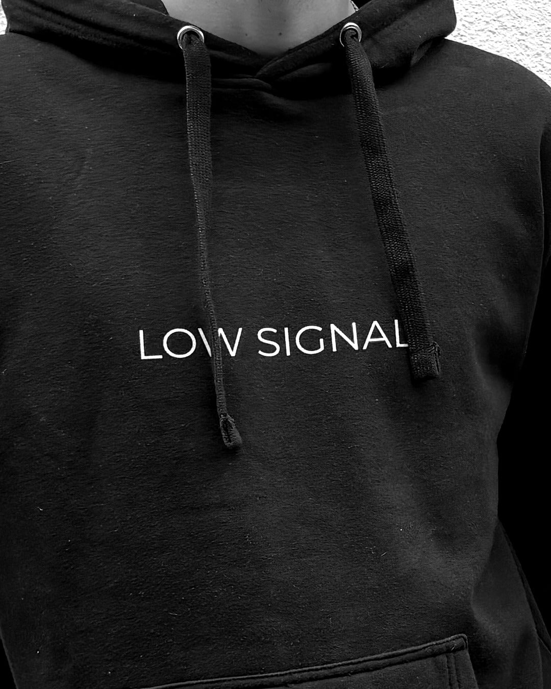 LOW SIGNAL CORE Hoodie in Carbon Black, close-up of hood and flat drawstrings