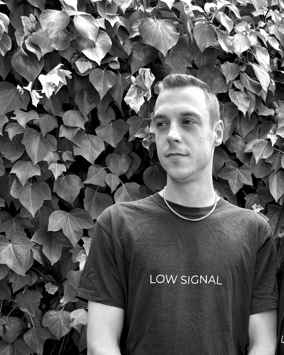LOW SIGNAL CORE Tee in Deep Charcoal, worn — black and white